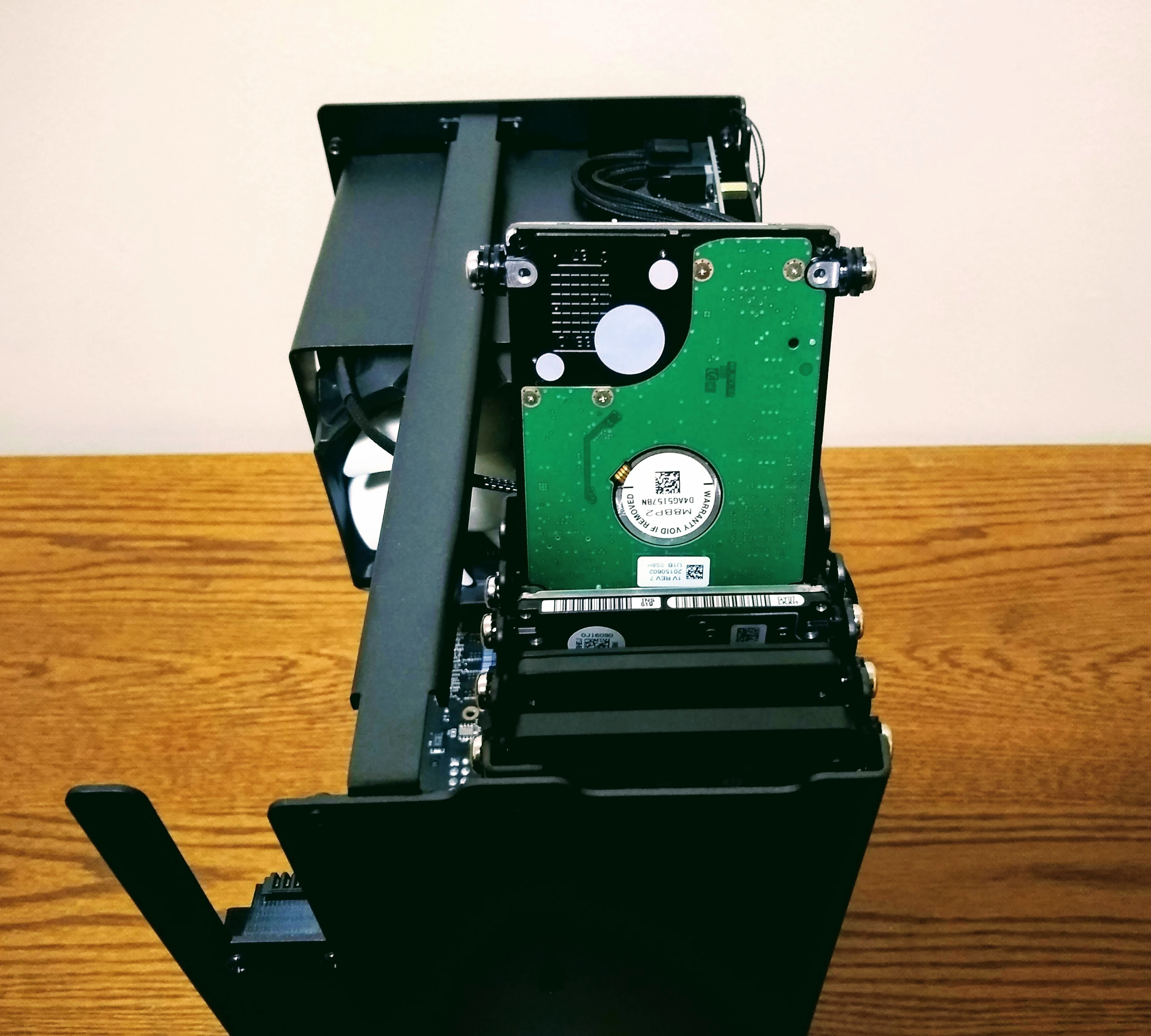 The drive cage of my Thelio with one drive out of its slot.